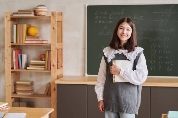 istock Girl Smiling at Camera in School 1330641227