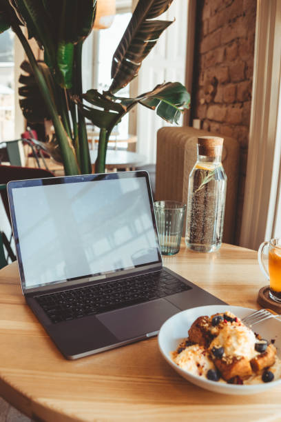 istock the laptop in cafe on the table with white screen in cafe 1330642539