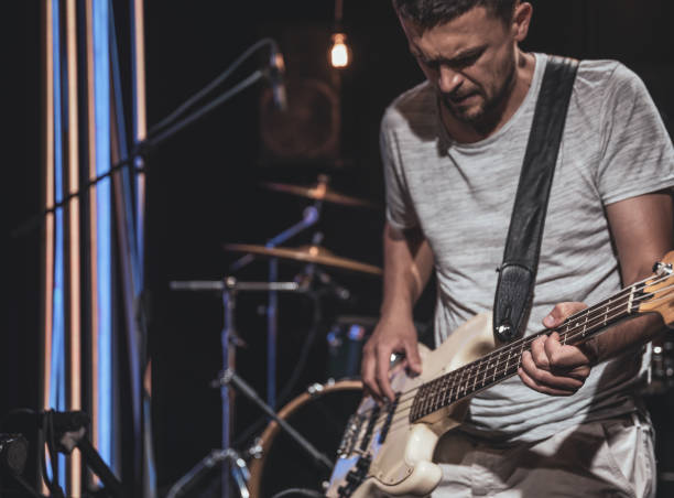 istock Musician with bass guitar during a performance. 1330643401