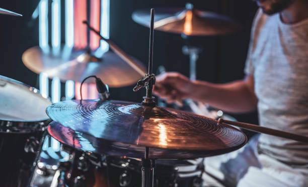istock Close-up of a drummer playing a drum cymbal on a blurred background. 1330643403