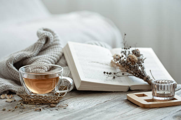 istock Home still life with a cup of tea and a book. 1330643625