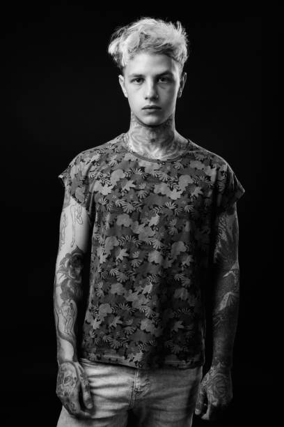 istock Young handsome rebellious man with blond hair in black and white 1330644515