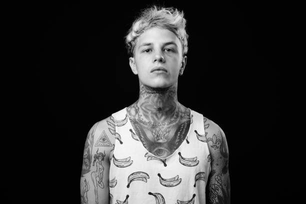 istock Young handsome rebellious man with blond hair in black and white 1330644521