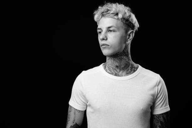 istock Young handsome rebellious man with blond hair in black and white 1330644687