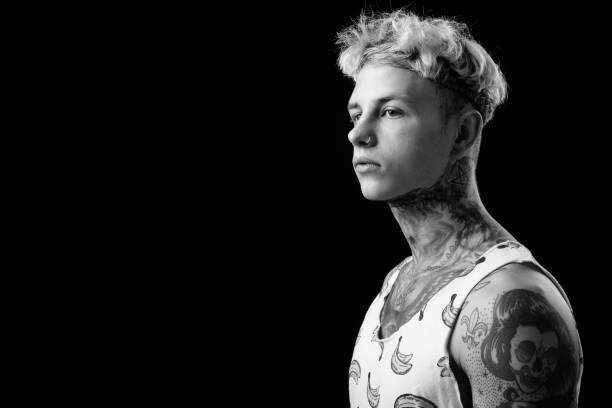 istock Young handsome rebellious man with blond hair in black and white 1330644743