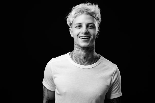 istock Young handsome rebellious man with blond hair in black and white 1330644820