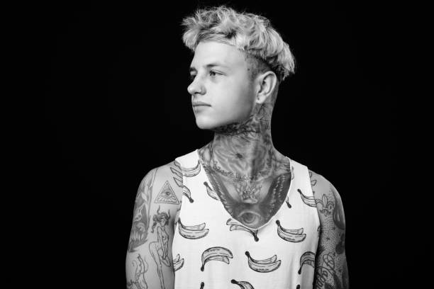 istock Young handsome rebellious man with blond hair in black and white 1330644825