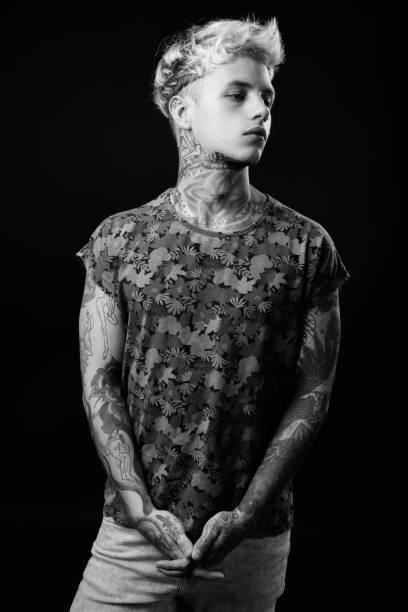 istock Young handsome rebellious man with blond hair in black and white 1330644876