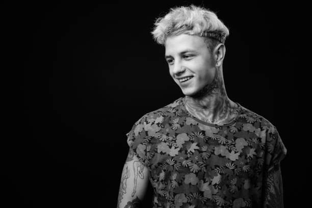 istock Young handsome rebellious man with blond hair in black and white 1330644883