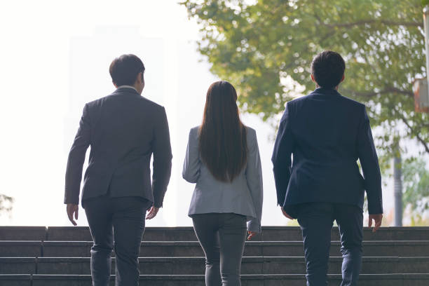 istock asian business team walking on steps 1330645595