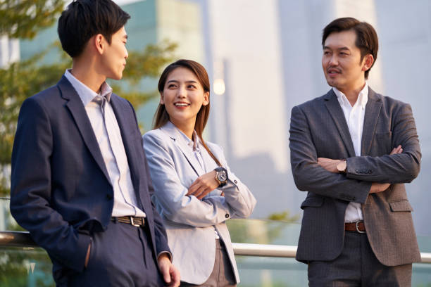 istock asian corporate executives relaxing outdoors 1330645613