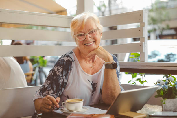 istock Confident senior woman working in her coffee shop 1330648837