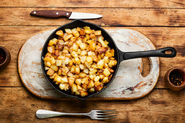istock Roasted potatoes in iron skillet 1330649301