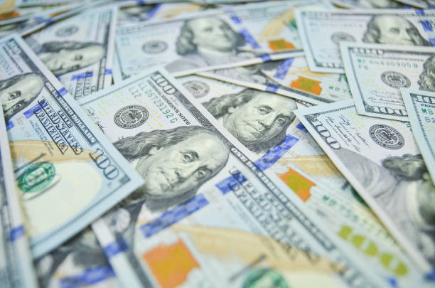 Pile of USD currency or USD currency on floor. stock photo