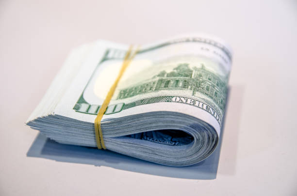 Folded hundred dollar bills stock photo