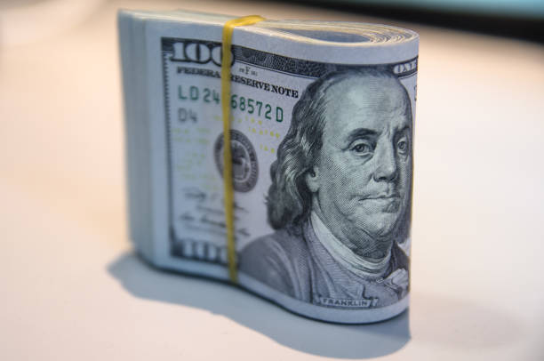 Folded hundred dollar bills stock photo