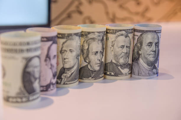 American dollars in rolls. Saving money concept. stock photo