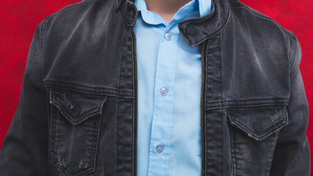 istock Jeans jacket and blue shirt worn by a man 1330652397