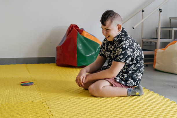 disabled child doing sensory activity with toys, rehabilitation
