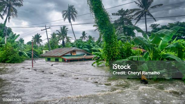 A Rural Home Being Submerged By Floodwaters Caused By Torrential Rain In The Philippines Stock Photo - Download Image Now