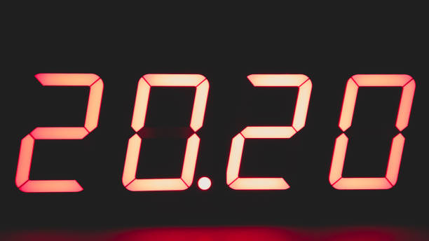 istock Digital clock with red led light illumination numbers 2020 in the dark 1330653107