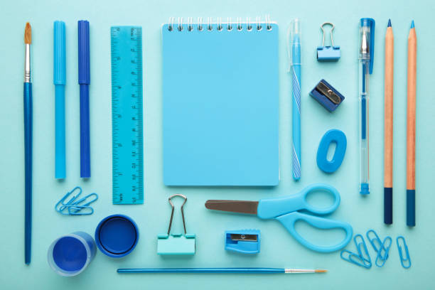istock Blue school supplies on blue background. Back to school. Flat lay. 1330653490