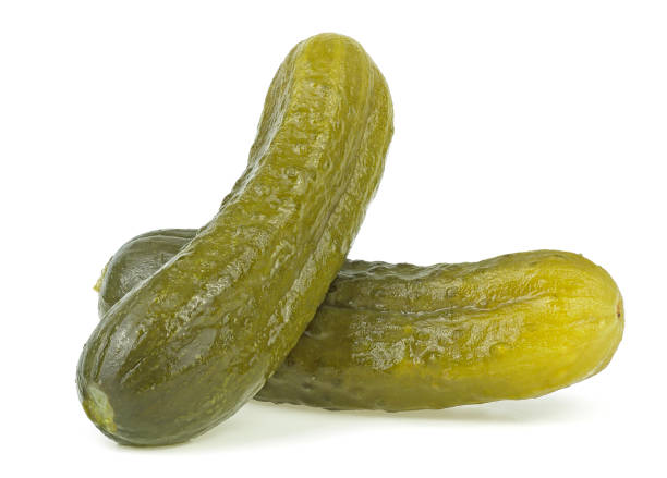 istock Two marinated pickled cucumbers isolated on a white background. Delicious pickled cucumbers. 1330656943