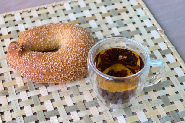 Cup of tea and sesame bagel