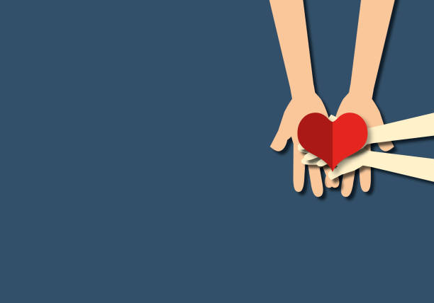 istock Hand holding a heart,  family love, warmth, unity, oneness. 1330663884
