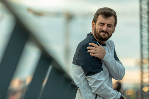 istock Young Man Suffered a Shoulder Injury During Morning Exercise 1330664718
