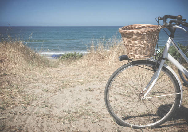 Parked bike with basket Bike on the seaside background sabaudia stock pictures, royalty-free photos & images