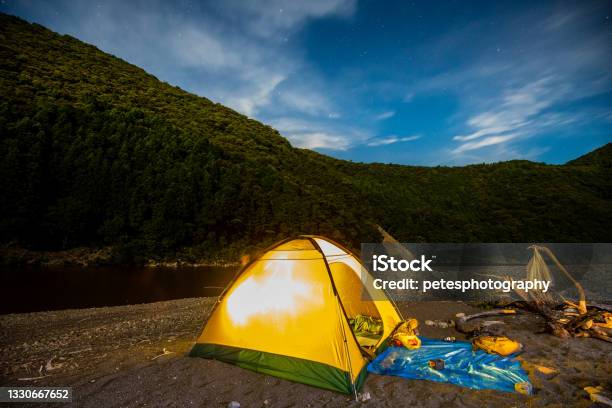 Illuminated Tent Camping Under The Stars By A Lake Stock Photo - Download Image Now - Kumano - Mie, Adventure, Awe