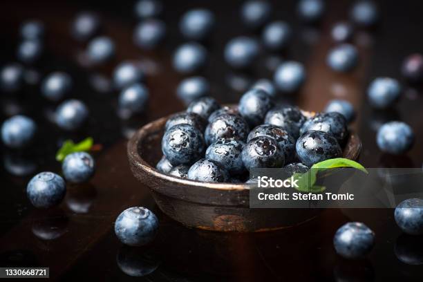 Fresh Blueberry Fruit In A Bowl On Dark Background Stock Photo - Download Image Now - Bilberry - Fruit, Antioxidant, Backgrounds