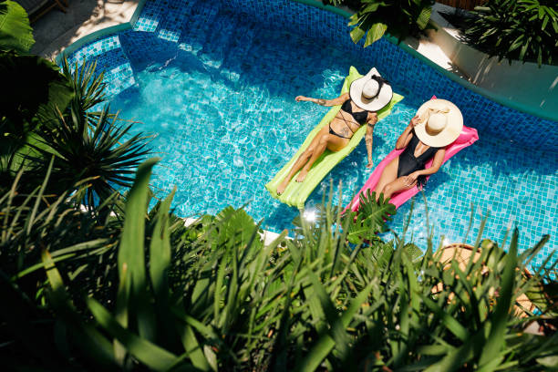 istock Women Relaxing on Floating Mattresses 1330669697