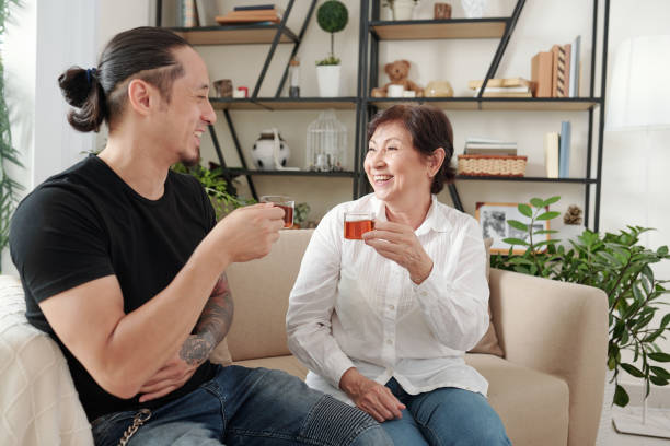 istock Family drinking tea at home 1330671395