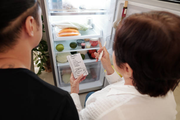 istock Mother making shopping list for her son 1330671515