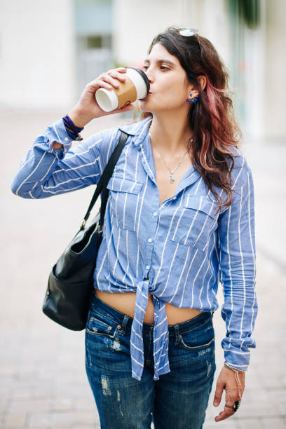 istock Woman Drinking Coffee Outdoors 1330671750