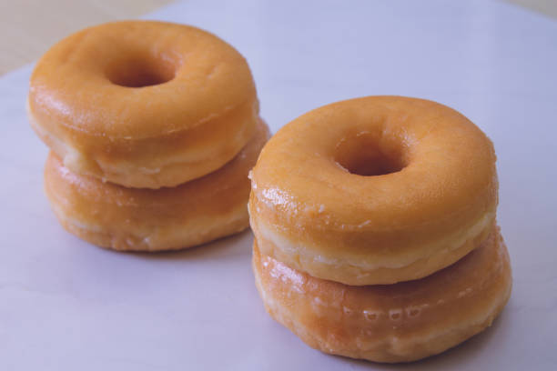 istock delicious sugary donuts on marbled white background 1330671786
