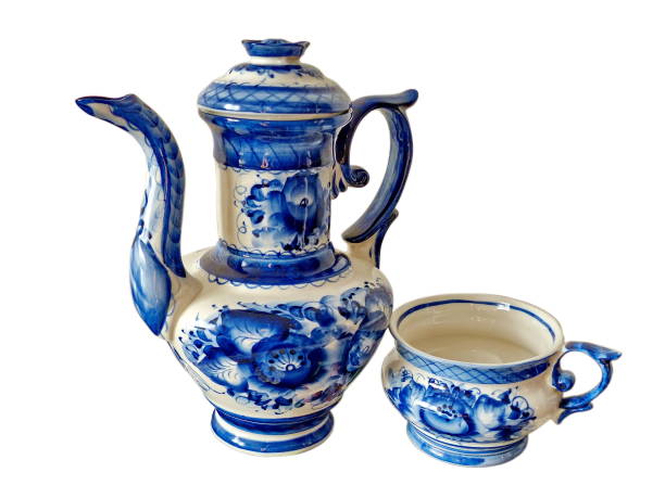 istock Teapot and Cup. Tableware in the Russian traditional Gzhel  style on white background, isolated.. Gzhel-Russian folk craft of ceramics and production porcelain and a kind of Russian folk painting. 1330671850