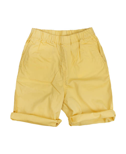 istock Yellow folded leg short pants on white background 1330673122