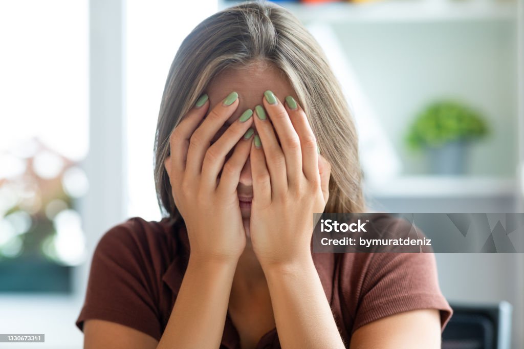Woman receiving bad news Embarrassment Stock Photo