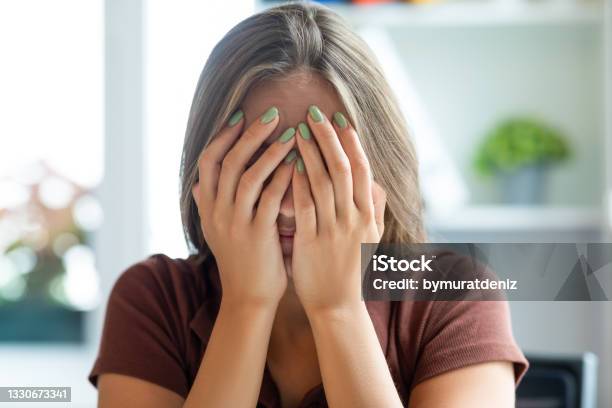 Woman Receiving Bad News Stock Photo - Download Image Now - Embarrassment, Women, Guilt