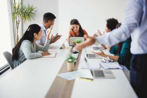 istock Multiracial business team group disputing in office boardroom 1330678958