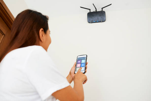 istock Housewife Setting Wi-fi Router 1330679775