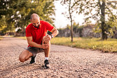 Sportsman hurting his knee during running