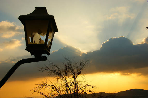 istock broken lantern and clouds. broken glass in a lantern against a background of dramatic clouds 1330679987