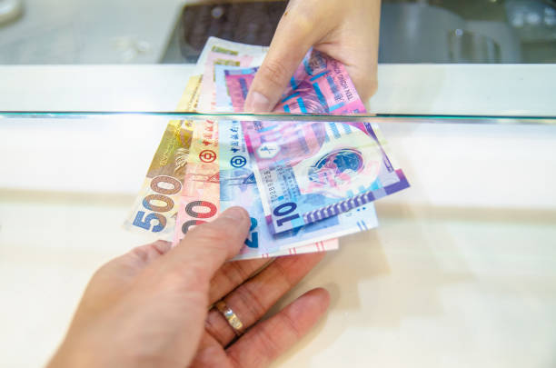 Exchange money for Hong kong money or Hong Kong dollar. stock photo