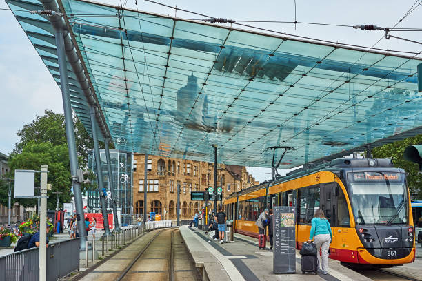 Heilbronn Heilbronn, Germany - July 17, 2021: Passengers get on the tram at the stop in front of the train station in Heilbronn. heilbronn stock pictures, royalty-free photos & images