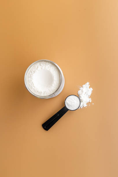 istock Whey protein powder in scoop and tape measure 1330687218