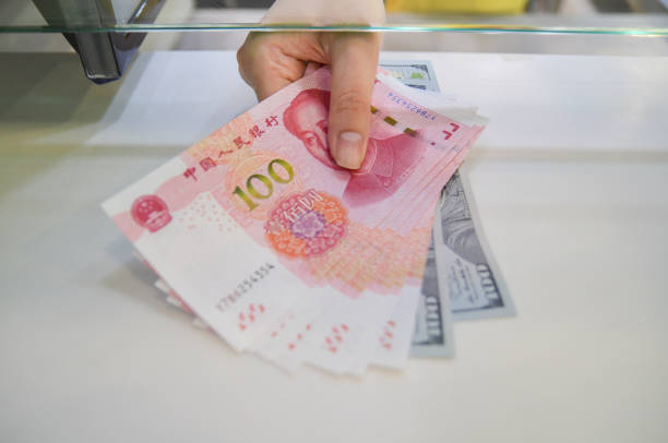 istock Exchange money, Exchange for US dollar or American dollars (USD) and Chinese. 1330687977